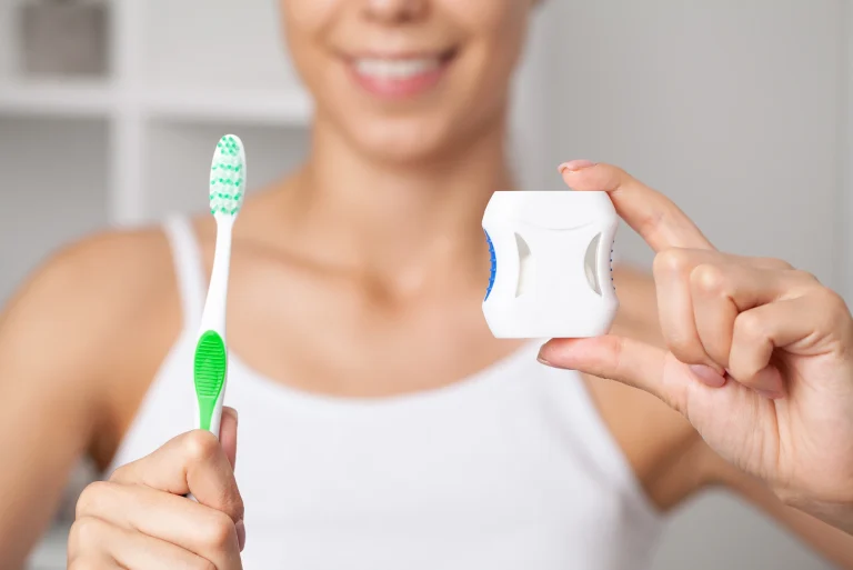 dental cleaning with toothbrush and floss